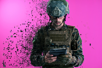 Image showing soldier using tablet computer closeup pixelated