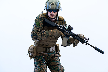 Image showing soldier in action aiming laseer sight optics