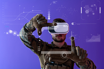 Image showing soldier using  virtual reality headset purple background