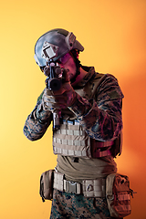 Image showing modern soldier against yellow background