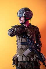 Image showing modern soldier against yellow background