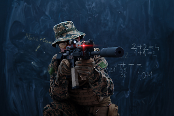 Image showing soldier in action aiming laseer sight optics