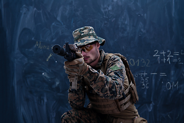 Image showing soldier in action aiming laseer sight optics