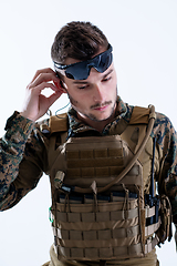 Image showing soldier preparing gear for action