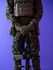 Image showing modern warfare soldier purple backgorund