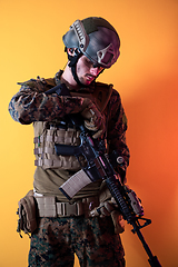 Image showing modern soldier against yellow background