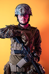 Image showing modern soldier against yellow background