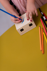 Image showing little girl painting jewelry box