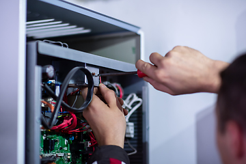 Image showing electrician engineer working with electric cable wires