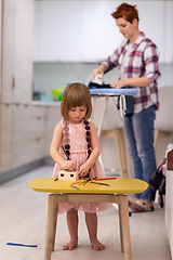 Image showing mother and daughter spending time together at home