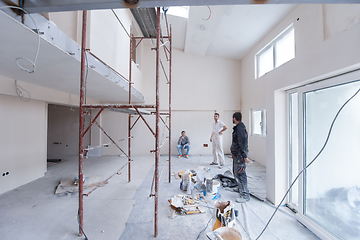 Image showing portrait of Workers and builders with dirty uniform in apartment