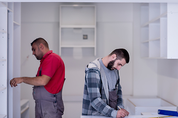 Image showing workers installing a new kitchen