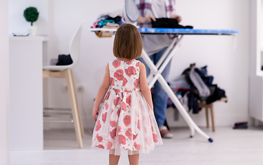 Image showing mother and little daughter spending time together at home