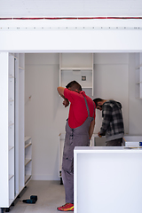 Image showing workers installing a new kitchen