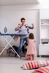 Image showing mother and little daughter spending time together at home