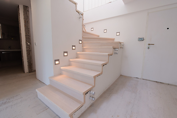 Image showing stylish interior with wooden stairs