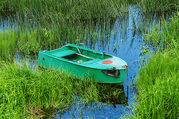 Image showing Metal rowboat on the lake 