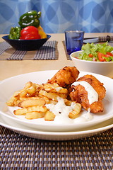 Image showing French fries and chicken