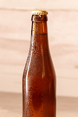 Image showing a bottle of amber beer with its capsule