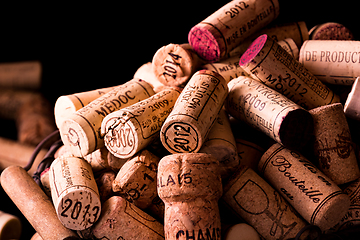 Image showing old cork stoppers of French wines in a wire basket