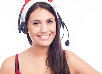 Image showing Christmas headset woman from telemarketing call center wearing red santa hat talking smiling isolated on white background.