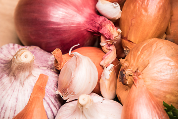 Image showing garlic onion shallot parsley on a wooden board