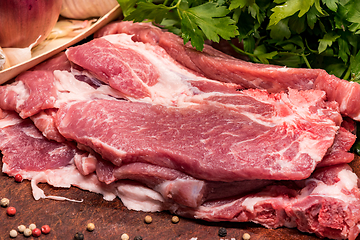 Image showing Raw pork ribs in the loin on a wooden board