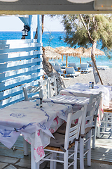 Image showing restaurant terrace in front of the beach in kamari on the island