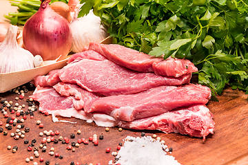 Image showing Raw pork ribs in the loin on a wooden board