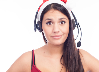 Image showing Christmas headset woman from telemarketing call center wearing red santa hat talking smiling isolated on white background.