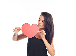 Image showing beautiful happy young woman who is holding a big red heart for v