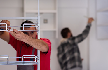 Image showing workers installing a new kitchen