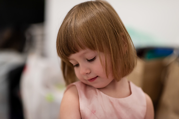 Image showing portrait of little girl playing at home