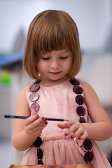 Image showing little girl painting jewelry box