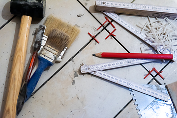 Image showing Ceramic tiles and tools for tiler