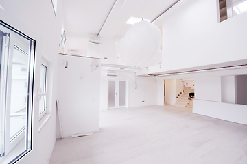 Image showing Interior of empty stylish modern open space two level apartment