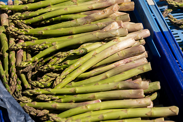 Image showing crate of fresh green asparagus on a market