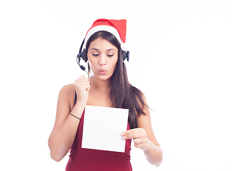 Image showing Christmas phone operator woman showing blank signboard