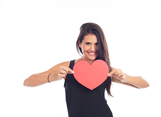 Image showing beautiful happy young woman who is holding a big red heart for v