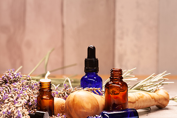 Image showing lavender mortar and pestle and bottles of essential oils for aro