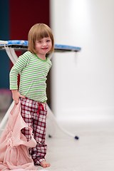 Image showing portrait of cute little girl playing at home