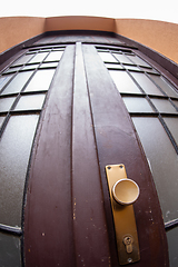 Image showing Close up outdoor view of an old wooden double door