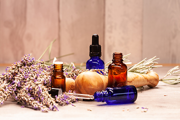 Image showing lavender mortar and pestle and bottles of essential oils for aro