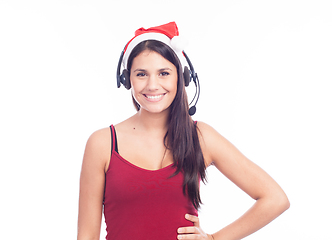 Image showing Christmas headset woman from telemarketing call center wearing red santa hat talking smiling isolated on white background.