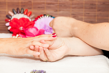 Image showing Applying nail polish on a woman\'s hands