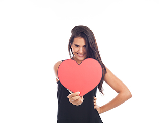 Image showing beautiful happy young woman who is holding a big red heart for v