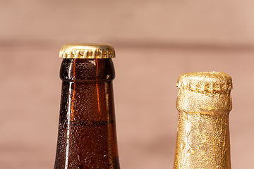 Image showing a bottle of blond beer and a bottle of amber beer