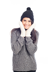 Image showing pretty brunette woman with a woolen hat a sweater and gloves smi