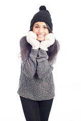 Image showing pretty brunette woman with a woolen hat a sweater and gloves tha