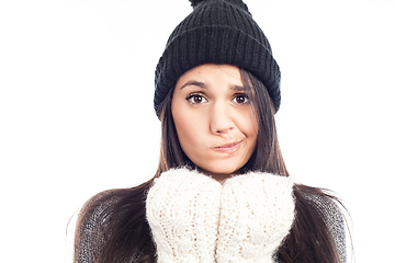 Image showing pretty brunette woman with a woolen hat a sweater and gloves tha